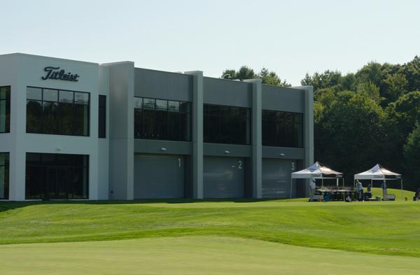 Fitting clubs set up on the practice tee