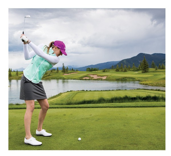 Golfer Playing an Iron Shot off the Tee