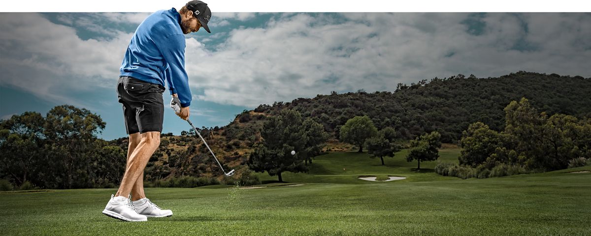 Golfer swinging t-series iron