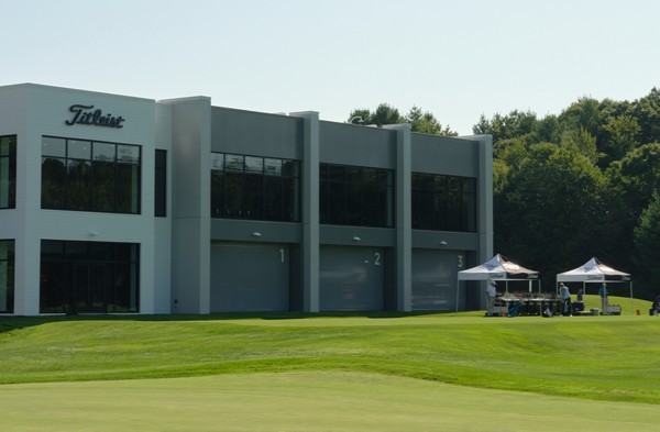 Fitting clubs set up on the practice tee